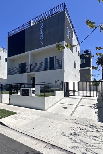 Los Angeles townhouse for rent - A modern building with the number 218 on it.