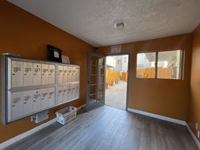 Los Angeles apartment for rent - A storage room with numbered lockers and a sign on the wall at 3615 Watseka Ave, Los Angeles, CA, 90034