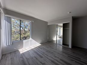 Los Angeles apartment for rent - A room with a large window and sliding glass doors at Lido Apartments - 3130 Bagley Ave, Los Angeles, 90034
