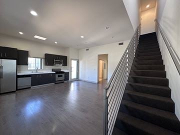 Los Angeles apartment for rent - A spacious kitchen with a refrigerator, microwave, and oven.