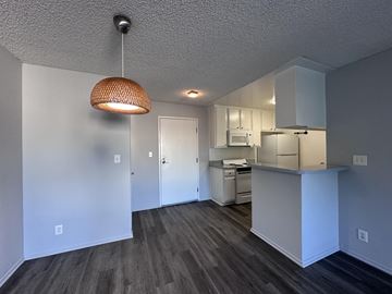 Los Angeles apartment for rent - A kitchen area with a microwave, oven, and cabinets.