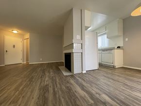 Los Angeles apartment for rent - A room with wooden flooring and a white door.