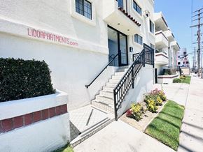 Los Angeles apartment for rent - A white building with the name LIDOAPARTMENTS.COM on the side.