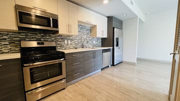 Los Angeles apartment for rent - A modern kitchen with a stainless steel oven and microwave.
