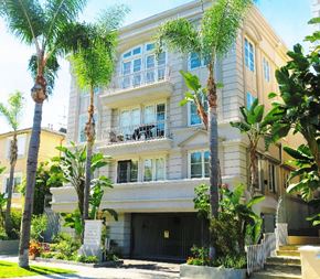 Los Angeles apartment for rent - A building with a balcony and a sign in front of it.