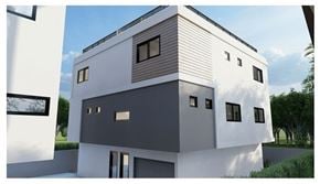 Los Angeles townhouse for rent - A modern house with a white and grey exterior and a sloped roof.