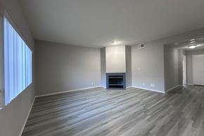 Los Angeles apartment for rent - A spacious living room with a fireplace and hardwood flooring. at Property Name Apartments, California