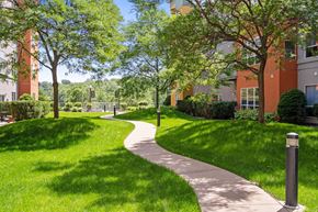 St. Paul apartment for rent - a path through the grass in front of a building