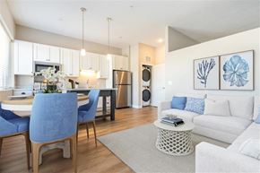 Bloomington apartment for rent - A modern kitchen with a dining table and chairs.