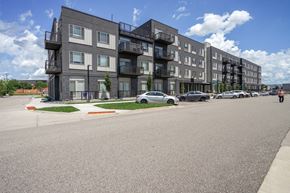 Bloomington apartment for rent - Apartment building with cars parked in front.