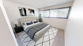 Hopkins apartment for rent - a bedroom with a bed and a large window