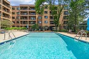 St. Paul apartment for rent - a swimming pool with an apartment building in the background