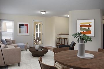 Plymouth apartment for rent - A living room with a brown table and a painting on the wall.
