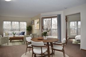 Plymouth apartment for rent - A dining room with a table set for six.