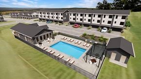 Inver Grove Heights townhouse for rent - A resort with a swimming pool and a car parked in front of the building.