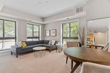 Bloomington apartment for rent - a living room with a couch and a dining table