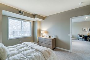 New Brighton apartment for rent - Bedroom with a dresser and bed and light green walls