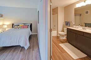 St. Paul apartment for rent - a bedroom with a bed and a bathroom with a toilet