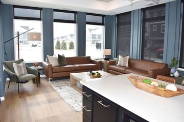 Inver Grove Heights townhouse for rent - A living room with brown leather couches and a wooden coffee table.