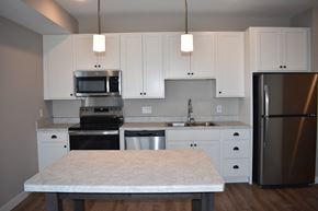 Bloomington apartment for rent - Spacious Kitchen with white cabinetry and stainless steel appliances.