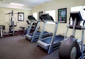 Minnetonka apartment for rent - a room with three treadmills and other exercise equipment