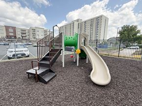 Hopkins apartment for rent - A playground with a slide, stairs, and a platform.