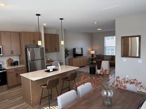 Inver Grove Heights townhouse for rent - A modern kitchen with a dining table set for four.