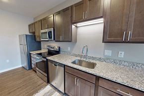 Eagan apartment for rent - a kitchen with granite counter tops and stainless steel appliances