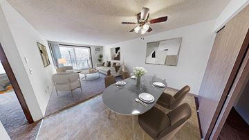 Hopkins apartment for rent - a living room with a dining room table and a ceiling fan