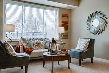New Brighton apartment for rent - a living room with a couch and chairs and a window