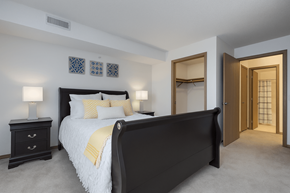 Brown Deer apartment for rent - A bedroom with a large bed and a dresser.