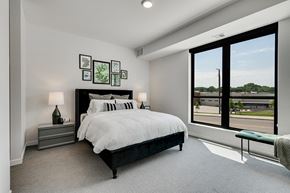 Robbinsdale apartment for rent - Bedroom with white walls, lamp shades, and comforters