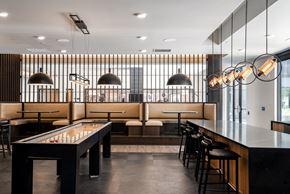Robbinsdale apartment for rent - Rec room with a variety of lighting and seating and a shuffleboard table