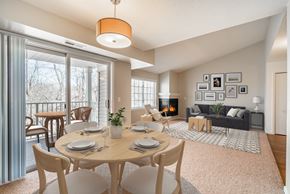 Minnetonka apartment for rent - A dining room with a table set for six with a view of the backyard.