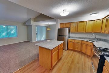 Minnetonka apartment for rent - a kitchen with wooden cabinets and stainless steel appliances