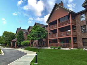 La Crosse apartment for rent - a large brick building with trees in the background