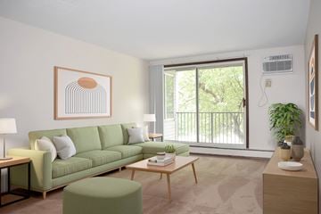 Hopkins apartment for rent - A living room with a green couch and a painting on the wall.