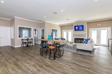Charleston apartment for rent - a living room with a couch and a table with chairs