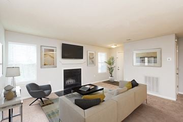 Greenville apartment for rent - the preserve at ballantyne commons living room with couch and fireplace