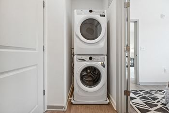 A front load washer and dryer in a laundry room