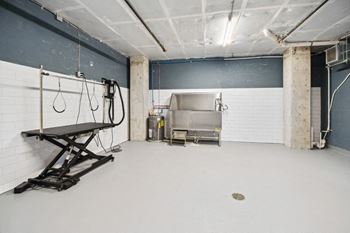 A large room with a sink and a machine in it