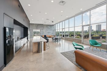 A modern kitchen with a view of the city.