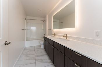 Bathroom with large mirror