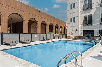 A swimming pool in front of a building