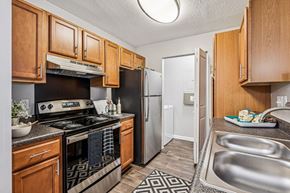 Durham apartment for rent - A kitchen with wooden cabinets at Park Ridge Estates, Durham, NC, 27713