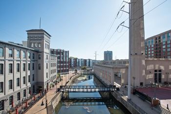 A canal runs through a city with buildings on either side