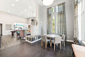 Charleston apartment for rent - A modern dining room with a glass table and chairs at Proximity Apartments, South Carolina, 29414