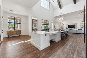 Fort Mill apartment for rent - a white kitchen with a large island and a dining room table at Beckett Farms Apartments, PRG Real Estate Management, Fort Mill, 29715