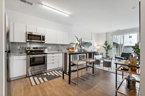 Hampton apartment for rent - a kitchen with white cabinetry and stainless steel appliances at The Constellation Apartments, PRG Real Estate, Hampton, Virginia