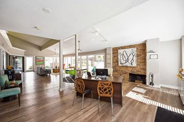 Louisville apartment for rent - a living room with a table and chairs and a fireplace